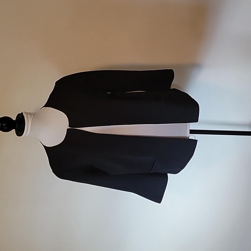 Ann Taylor black Polyester jacket with reoutdoor neck line.